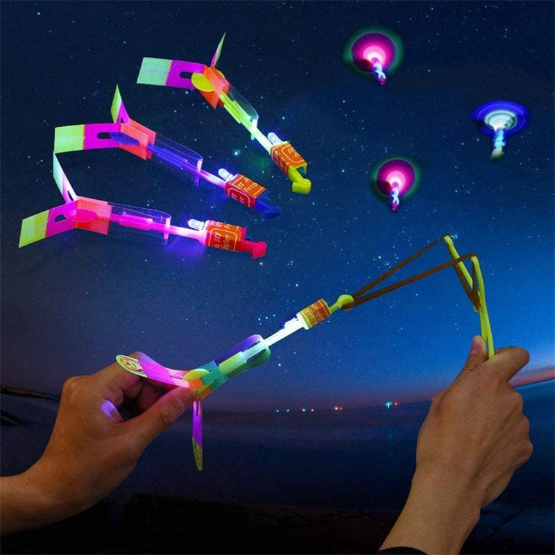 10Pcs LED Arrow Helicopter Slingshot Flying Outdoor Flashing Kids Toys